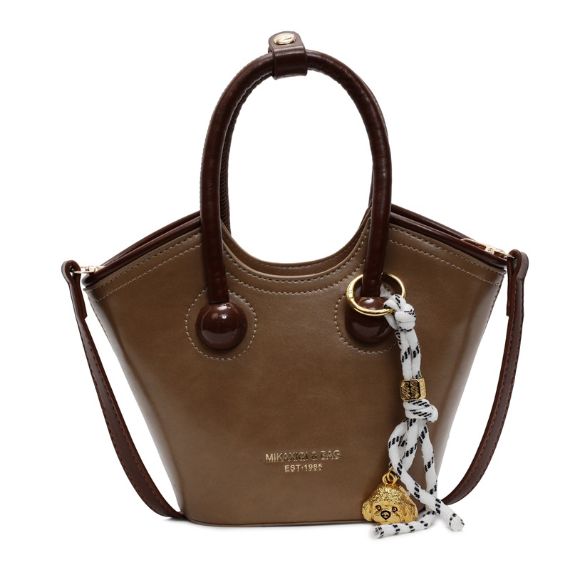 Bolsas de mano retro de color contrastante para mujeres 2025 nueva moda bolsas de hombro de estilo extranjero de alto nivel nicho bolsas de cubo