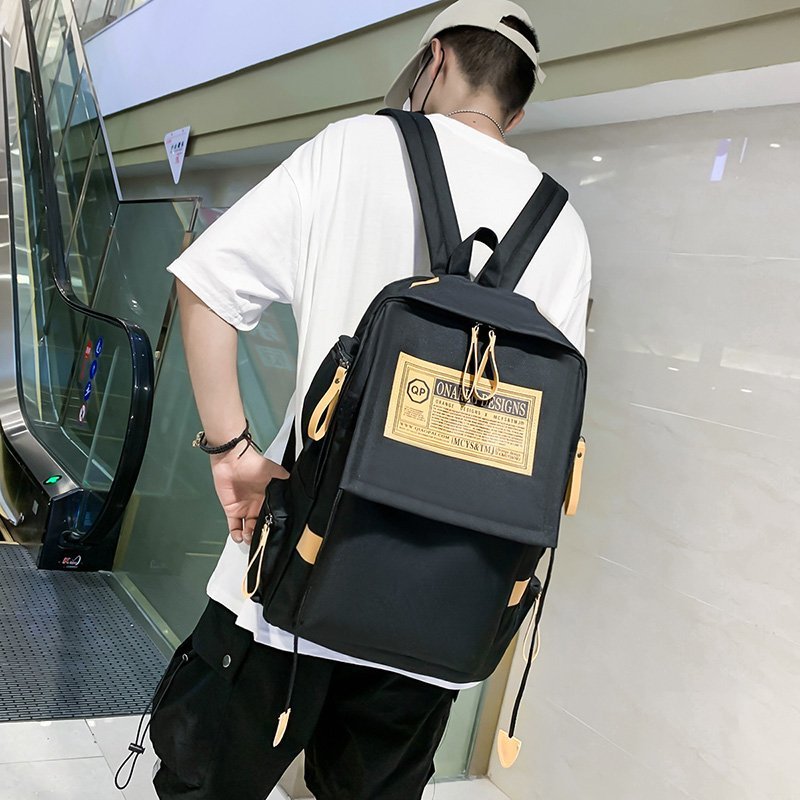 Korean version of female middle school students backpack wholesale backpack male plus LOGO large capacity travel bag business computer backpack