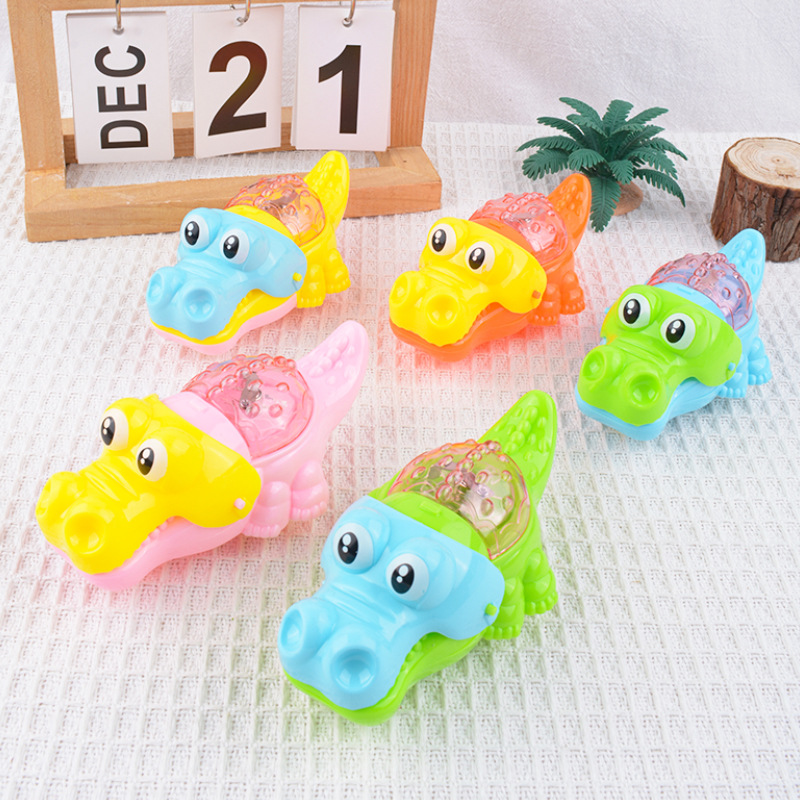Hilo de tracción creativo, cabello luminoso, dibujos animados de cocodrilo, lindo y divertido, tirón de cuerda, puesto de cocodrilo flash, juguetes para niños de azúcar al por mayor