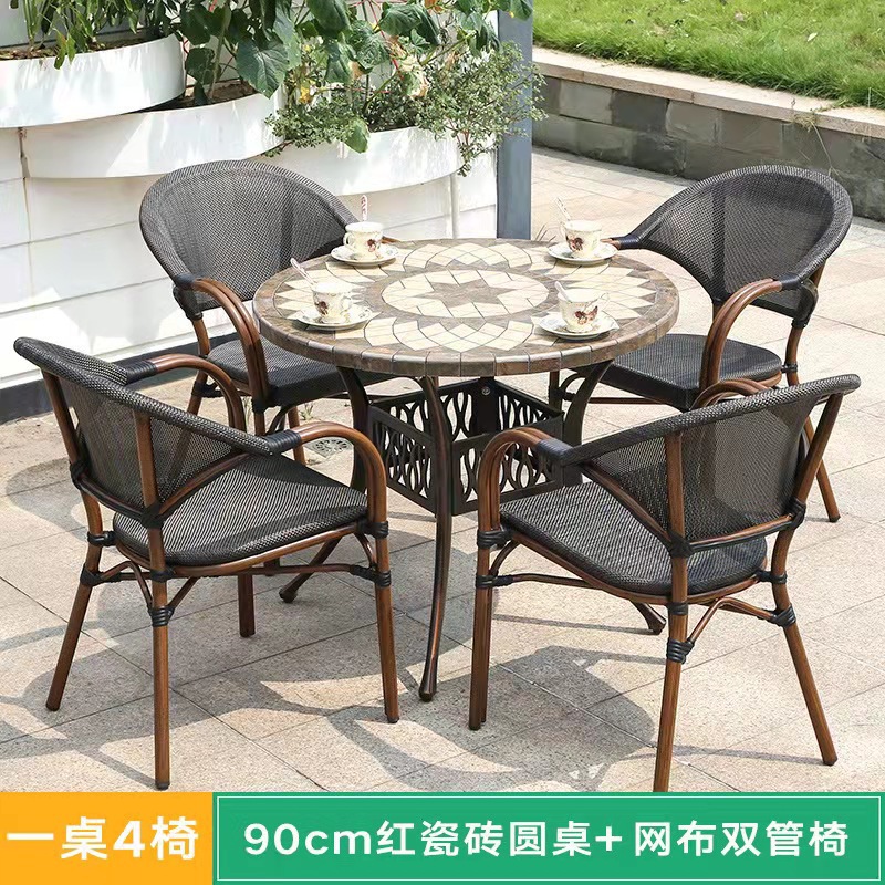 Mesa y silla al aire libre leche tienda de té cafetería silla de malla Silla de ratán Patio de tres piezas balcón mesa y silla de ocio al aire libre