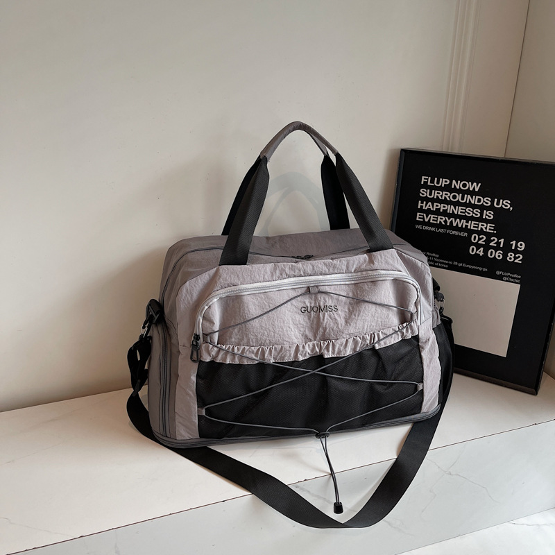 Nicho de diseño de moda moda moda bolsa de mano de mujer gran capacidad bolsa de viaje corto bolsa de almacenamiento bolsa de viaje deportiva al aire libre