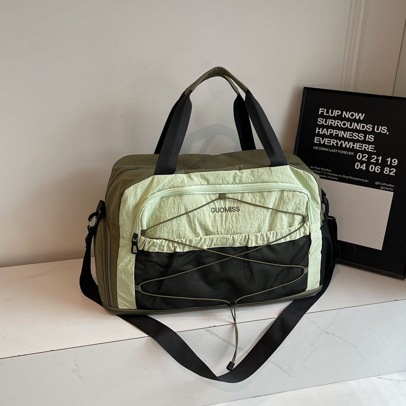 Nicho de diseño de moda moda moda bolsa de mano de mujer gran capacidad bolsa de viaje corto bolsa de almacenamiento bolsa de viaje deportiva al aire libre