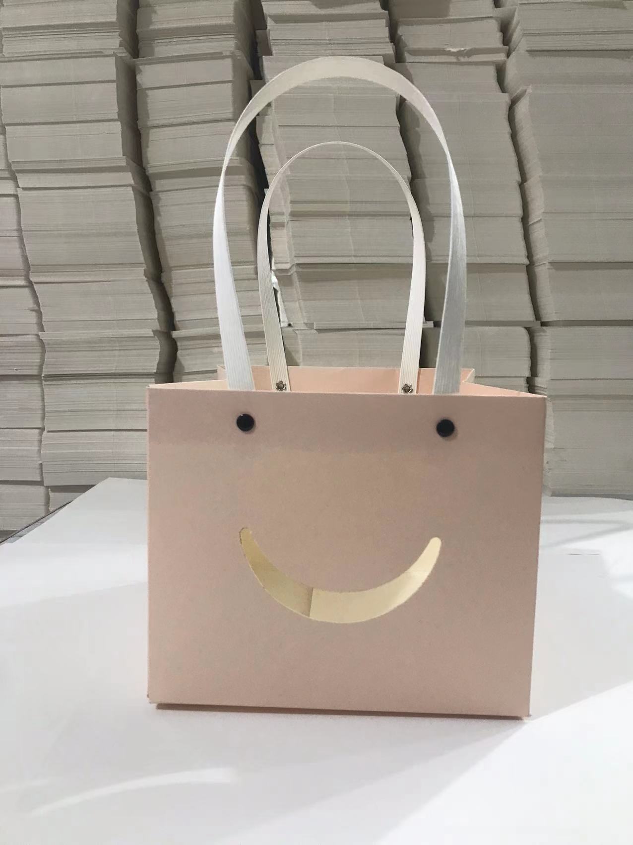 Bolso de mano con remache sonriente con ventana abierta transparente, caja de regalo de embalaje de vacaciones, joyería de juguete exquisita, bolsa de embalaje de plantas verdes al por mayor