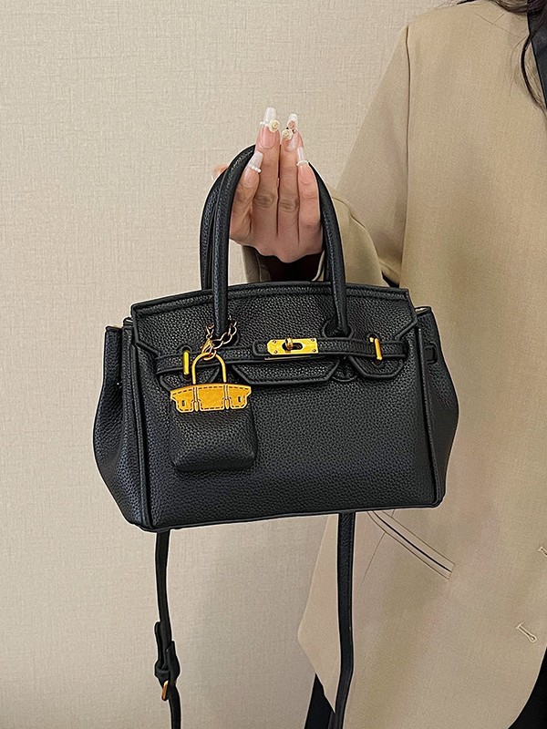 Bolso Kelly de moda coreana para mujer, nuevo modelo transfronterizo de gran venta con textura de alta calidad y diseño de lichi, bolso de hombro y bandolera.