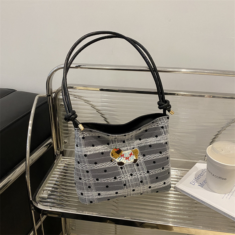 Bolsa de lona popular de este año para mujeres 2024 nuevo bolso de balde de verano de gran capacidad de alta calidad sensación de mochila de viaje