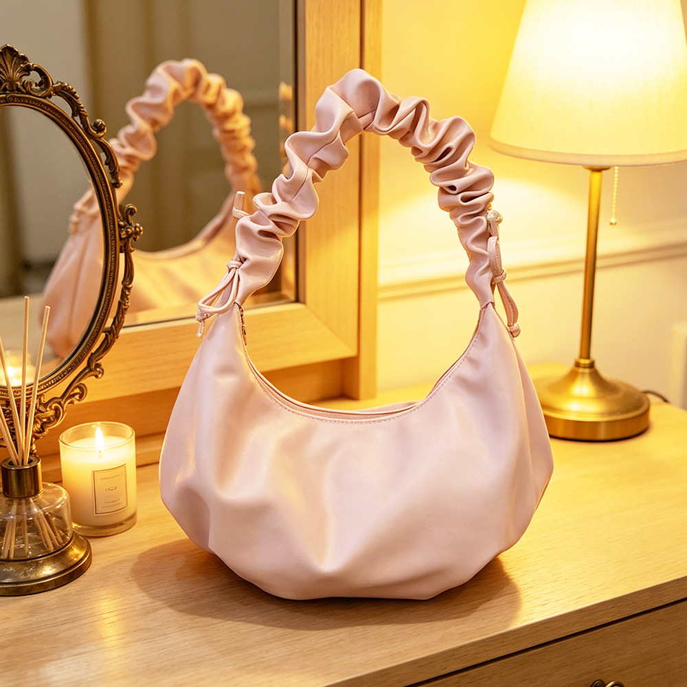 2026 nuevo estilo de mujer bolso de estilo extranjero bolso de moda alta sensación de nube bolso de hombro viento dulce simple plegado