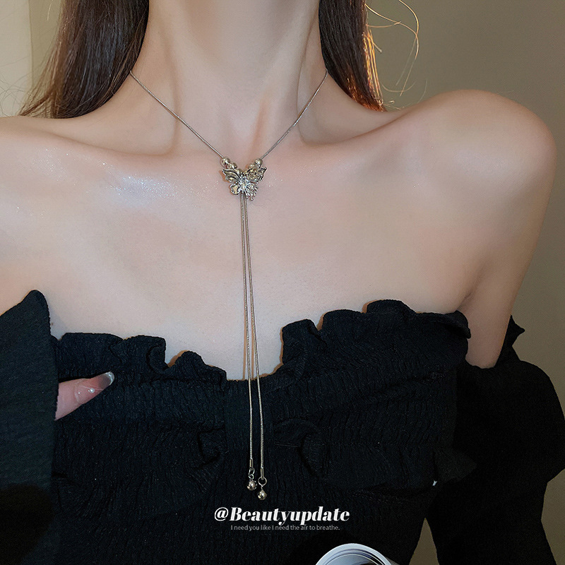Serie de plata Collar de borla de cuentas de mariposa ajustable Cadena de clavícula de moda exquisita Cadena de suéter de diseño de lujo ligero Mujer