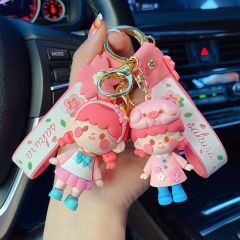 かわいい桜の女の子のキーは少女の心の公の子のカバンを掛けてお嬢さんの個性の自動車を飾ってネットの赤いプレゼントを飾ります。
