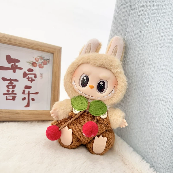 Brown knitted overalls + green leaf red ball fur collar