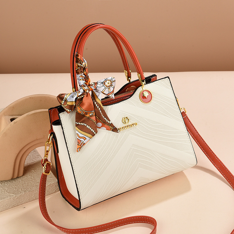 Bolsas de mujer transfronterizas 2025 nueva moda relieve bolsas de mano de gran capacidad bolsas de madres de mediana edad bolsas de hombro mochila