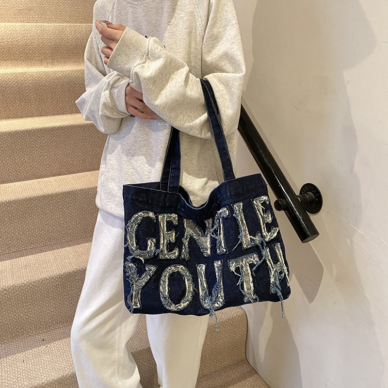 Bolsa de denim de gran capacidad para mujeres 2024 temperamento retro ocio clase de viaje de hombro inclinado bolso inferior