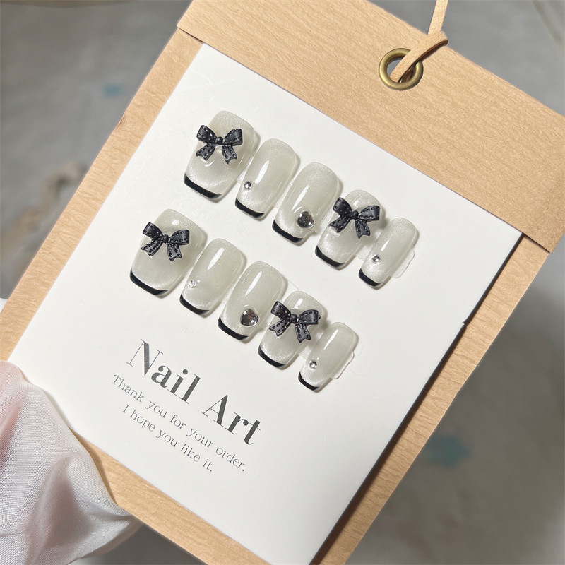 Uña hecha a mano pura arco de ojo de gato terapia de luz de uñas de alto nivel color sólido negro es un estilo de lujo ligero chino