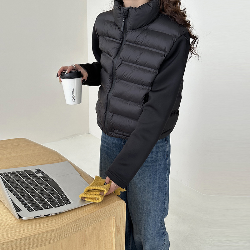 2024 nuevo producto negro ligero invierno Europa y América transfronterizas mujeres urbanas casuales manga larga empalmado abrigo de plumón