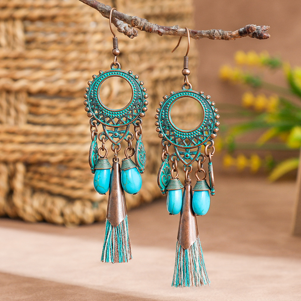 New vintage leaf pendant earrings women's fashion hollow carved alloy tassel earrings European and American fashion jewelry batch