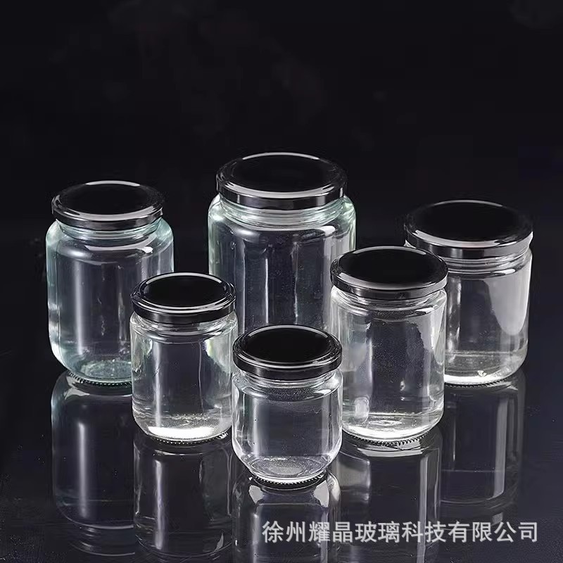 Botella de vidrio redonda de grado alimenticio, botella enlatada transparente sellada, botella de salsa de chile vacía, botella de miel con tapa para cocinar