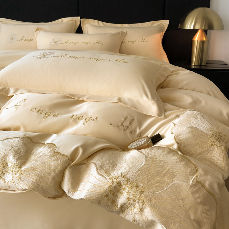 Nuevo traje de cuatro piezas con bordado de seda lavado, sábana de viento de lujo ligero, color sólido, sábana simple, funda de edredón al por mayor