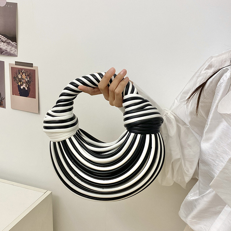 女包轻奢品牌个性创意包包女彩色拼条编织打结单肩斜挎包手挽包