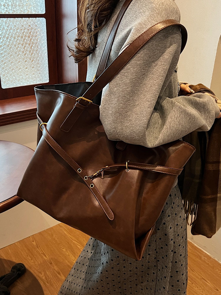Bolsos de mujer Bolsos de alta capacidad portátiles de todo fósforo 2025 nuevo estilo retro moda casual bolso de hombro sentido bolso de mujer