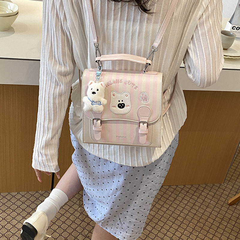 Caricatura encantadora oso, mochila para niños y niñas, mochila para niños a rayas extranjeras, nueva mochila coreana para padres e hijos.