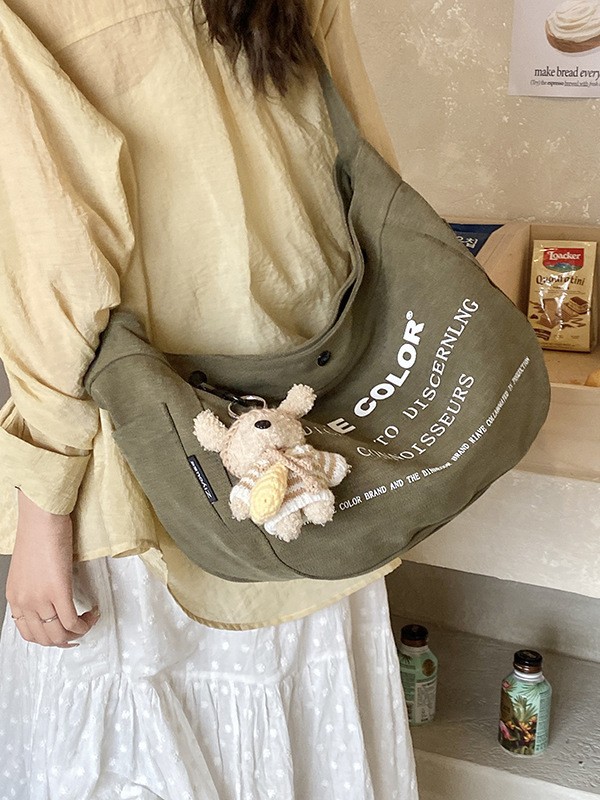 Bolsa de lona para mujeres 2026 nueva bolsa de gran capacidad transfronteriza impresa letras de viaje casual mochila de hombro