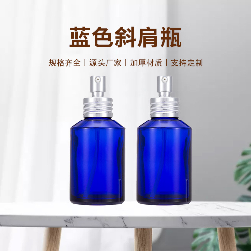厂家直供100ml蓝色斜肩瓶配电化铝亮银鸡咀可丝印烫金喷色