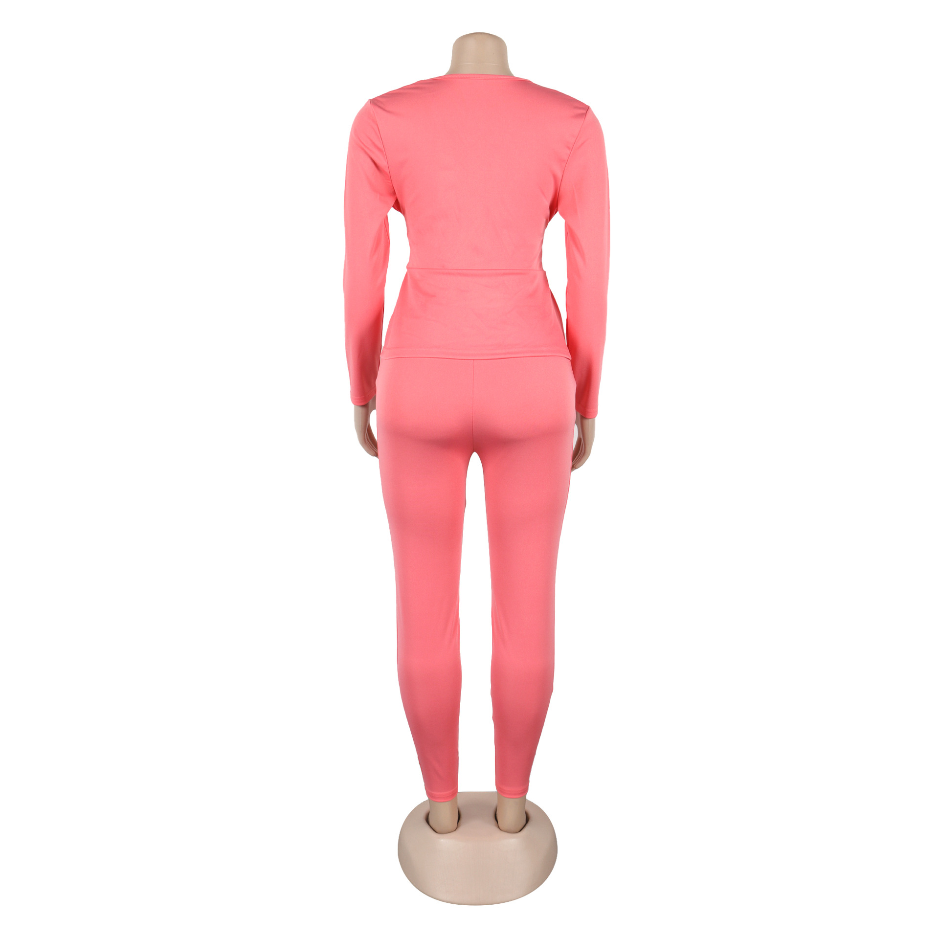 Conjunto de dos piezas de blusa y pantalón de manga larga con escote en V y cintura ajustada de color liso