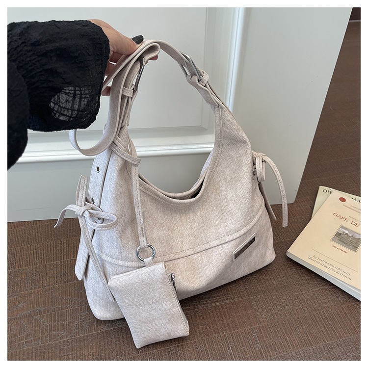 Bolso coreano de gran capacidad para mujeres 2026 verano nuevo viaje transfronterizo tote bag retro nicho mochila de hombro