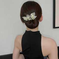 レトロな馬蹄蓮の飛葉盤の女性の新型の高級感が優雅で、大気のねじりがファッションに合わせて髪を挟みます。