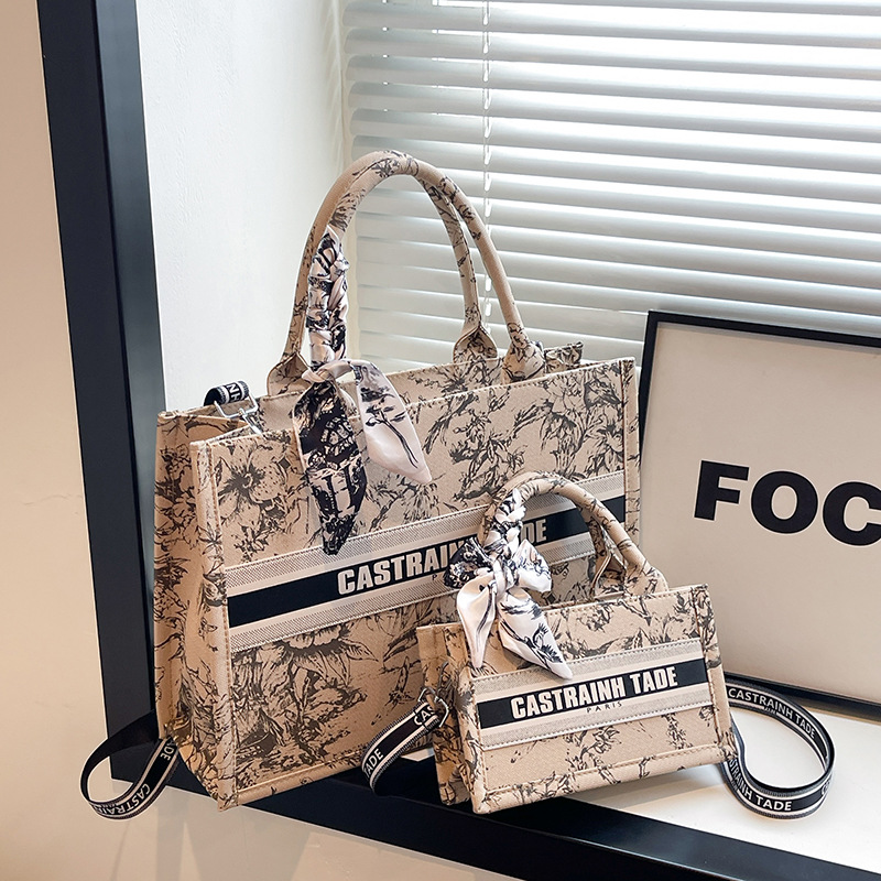 Bolsos de lona transfronterizos bolsos de mujer 2025 nueva moda retro letras impresas bolsos de hombro de gran capacidad