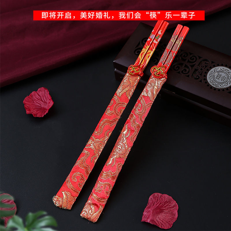 Red Festive Chopsticks for Wedding Gifts: Creative Dragon & Phoenix Design, 2-Pair Set with Brocade Cloth Covers, Perfect for Celebratory Banquets&mdash;Made from Bamboo and Wood in Vibrant Red