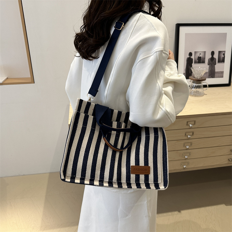 Bolsas de gran capacidad de transporte 2024 nuevas bolsas de mujer populares bolsas de lona a rayas bolsas de mochilas de moda bolsas de mano