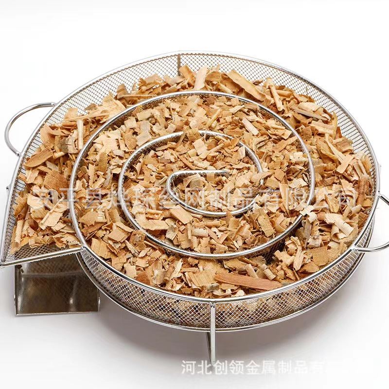 En stock de tipo Caracol de fumar bandeja de acero inoxidable de humo frío generador de carbón de barbacoa redonda Red de fumar cesta de fumar