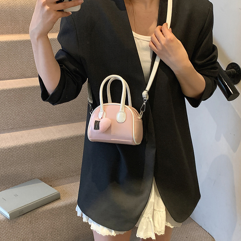 Bolsos coreanos para niños y niñas conchas de aire extranjero mini bolsos de mano de bebé de color sólido dulces bolsos para niños colgantes