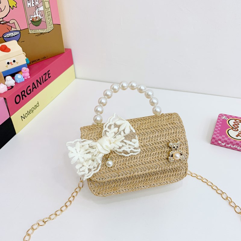 Verano nuevo arco de paja bolso de perla bolso de moda para niños bolso de princesa de jardín de infantes