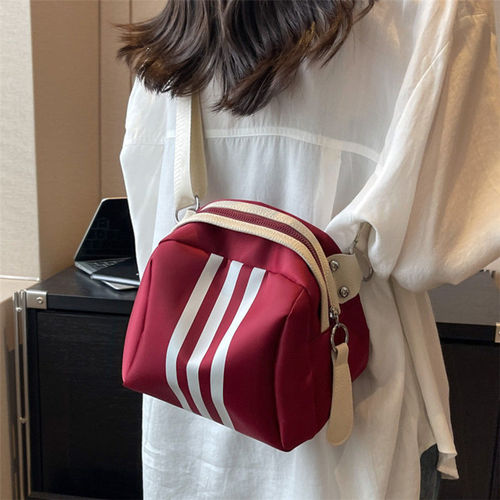 Fashionable and casual new nylon women's bag hand-held cross-body travel bag shell bag versatile sports style pillow bag