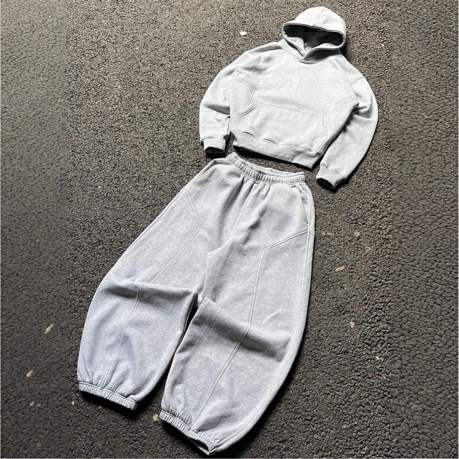 Trajes deportivos de ocio de otoño y invierno transfronterizos American Hooded Sweaters grises sueltos pantalones de piernas anchas pantalones multifuncionales para hombres