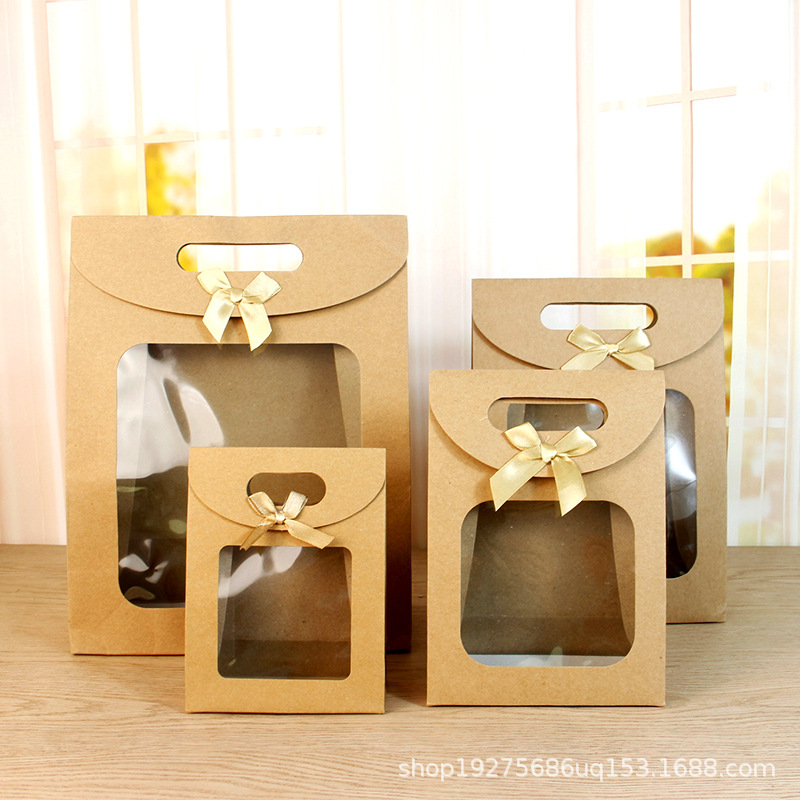 Bolsa de embalaje transparente de la ventana del arco del tirón en stock bolso al por mayor bolsa de papel de embalaje de regalo bolsa de regalo grande