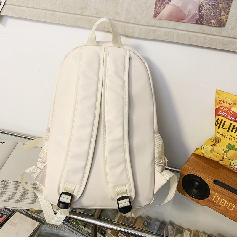 Fábrica al por mayor 2023 nueva mochila de PU de gran capacidad para estudiantes de secundaria de ocio, mochila de viaje al aire libre literaria simple