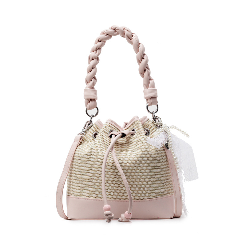 Bolso de cubo de mano de alta gama para mujer 2025 nuevo bolso de hombro con cordón de patrón tejido de moda bolso de mensajero de viaje de todo fósforo