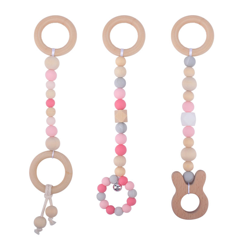 Nuevo Bebé calmante juguetes traje bebé cuentas de silicona haya molares mordedor juguetes pequeña campana Amazon