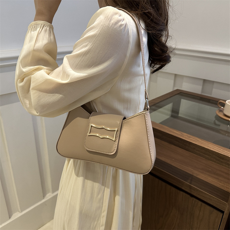 Bolso de brazo ligero de lujo para mujeres 2024 verano nuevo nicho de moda diseño de alta sensación ondulada mochila de hombro