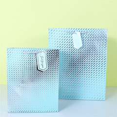 Full-page diamond pattern paper shopping bag with hanging tags, embossed and gold-leafed white card gift paper bag for wholesale