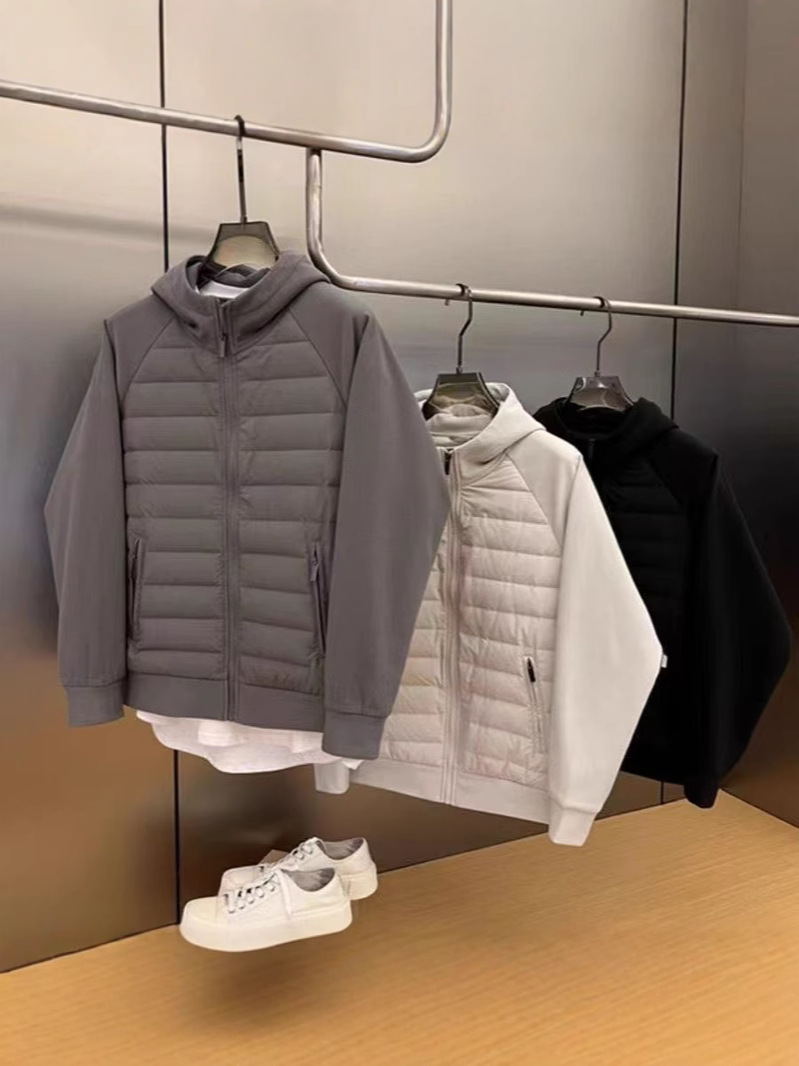 ファッション秋冬2025年帽子付きデザイン感カジュアルな純色の大衆が男性青年の帽子付きコートをつなぎ合わせて保温する