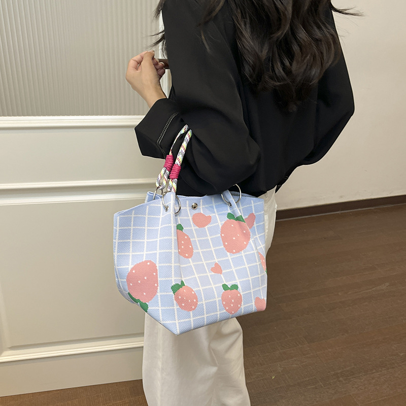 Bolsa de impresión coreana de niña nicho bolso de cubo de diseño diario versátil bolso de mano para estudiantes de viaje diario