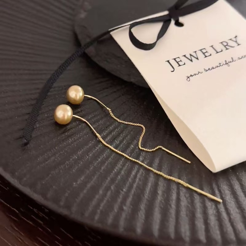 Nuevos cuentas de champagne con bordillos largos, líneas de orejas delgadas, diseño de personalidad simple y sofisticado, auriculares de alta calidad