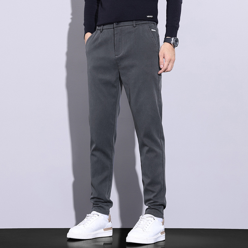 Pantalones juveniles populares para hombres casuales Otoño e Invierno nuevos pantalones antiarrugas resistentes al desgaste pantalones de todos los partidos juveniles elásticos pantalones casuales cómodos