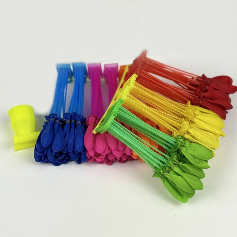 Feria del templo de globos al por mayor, los niños disparan globos pequeños, globos pequeños, globos redondos de agua, empujando los puestos del mercado nocturno