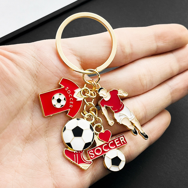 国境を越えてよく売れています。サッカー選手のユニホーム靴のキーホルダーは金属部品のワールドカップの周辺プレゼントです。|undefined