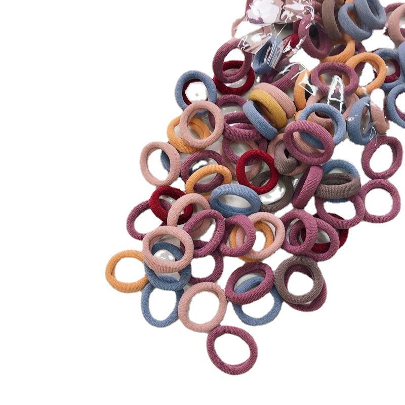 Banda de goma de bebé Corea del Sur banda de pelo de los niños anillo de toalla de color caramelo bolsa de Margarita banda de pelo OPP bolsa cuerda de pelo banda de goma al por mayor