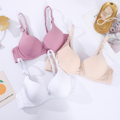 工場の現物の純色の光沢面の無痕のブラジャーの女性の上の薄い下の厚いは集まって無痕の下着の日系の小さいブラジャーを支えます。